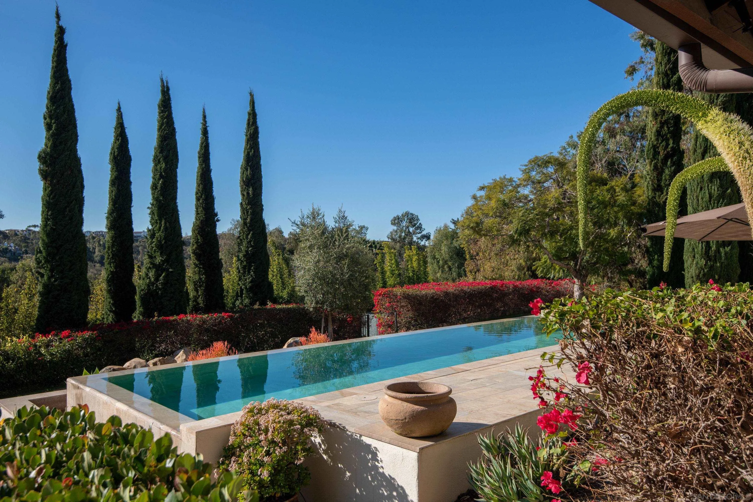 6511 Poco Lago Rancho Santa Fe, CA 92067 - Photo 13 of 24 a view of backyard with swimming pool and outdoor seating