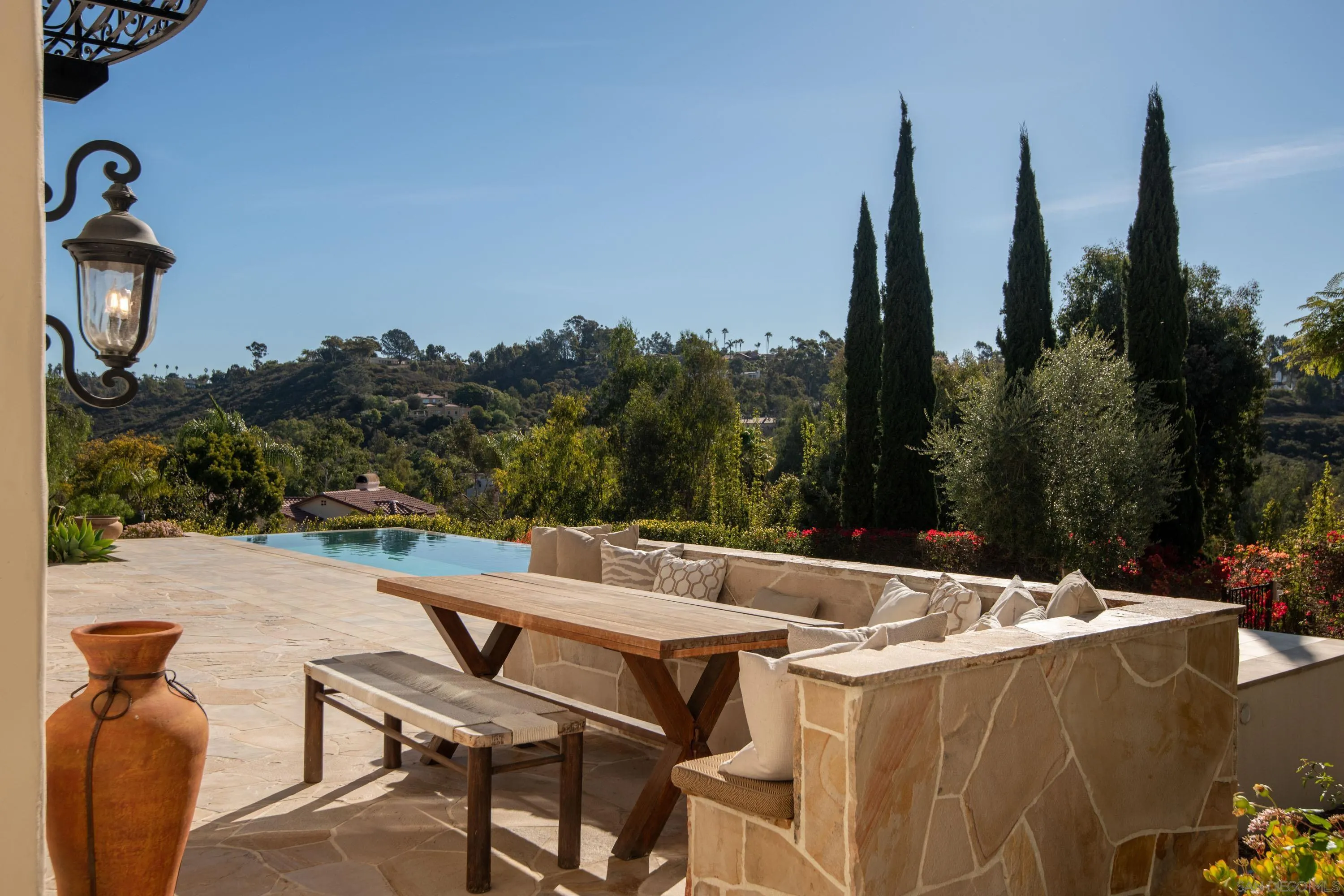 6511 Poco Lago Rancho Santa Fe, CA 92067 - Photo 14 of 24 a view of swimming pool with outdoor seating and plants
