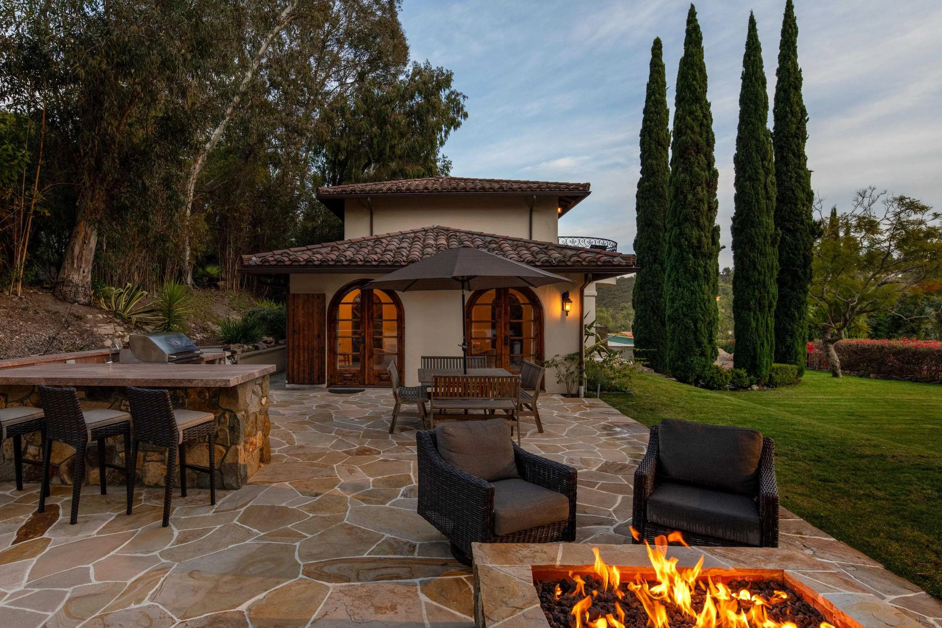 6511 Poco Lago Rancho Santa Fe, CA 92067 - Photo 21 of 24 a front view of a house with garden
