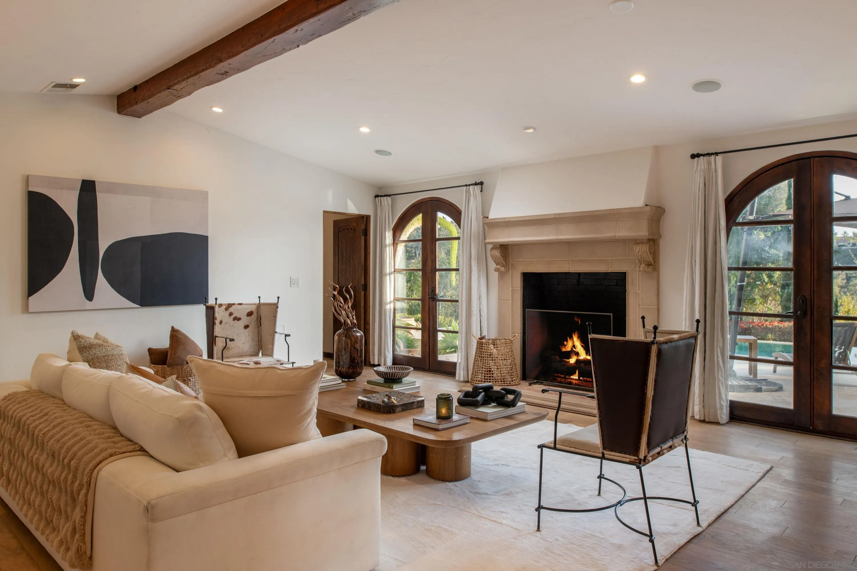 6511 Poco Lago Rancho Santa Fe, CA 92067 - Photo 3 of 24 a living room with furniture fireplace and a large window