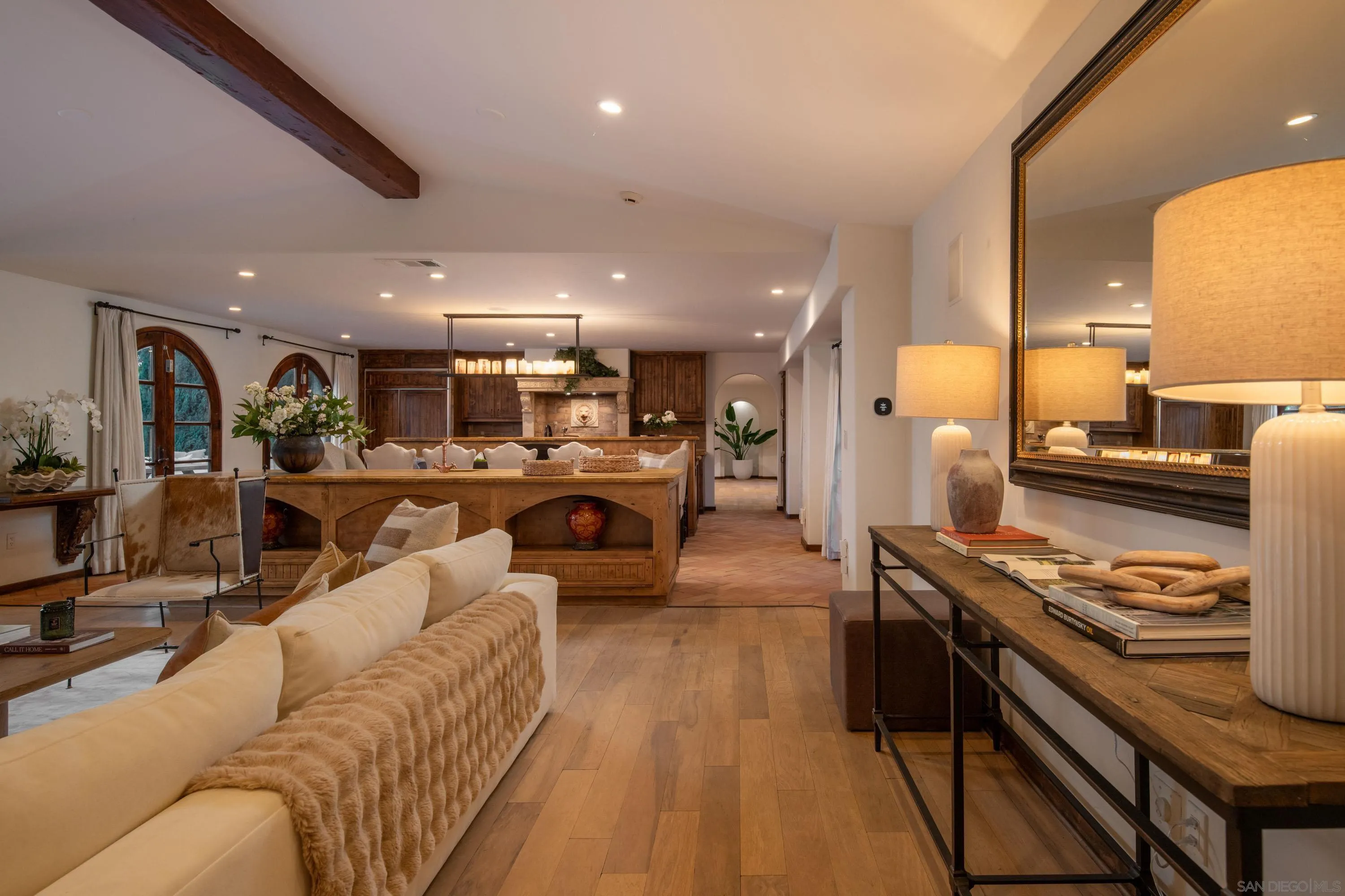 6511 Poco Lago Rancho Santa Fe, CA 92067 - Photo 4 of 24 a living room with stainless steel appliances kitchen island granite countertop lots of furniture and a view of kitchen