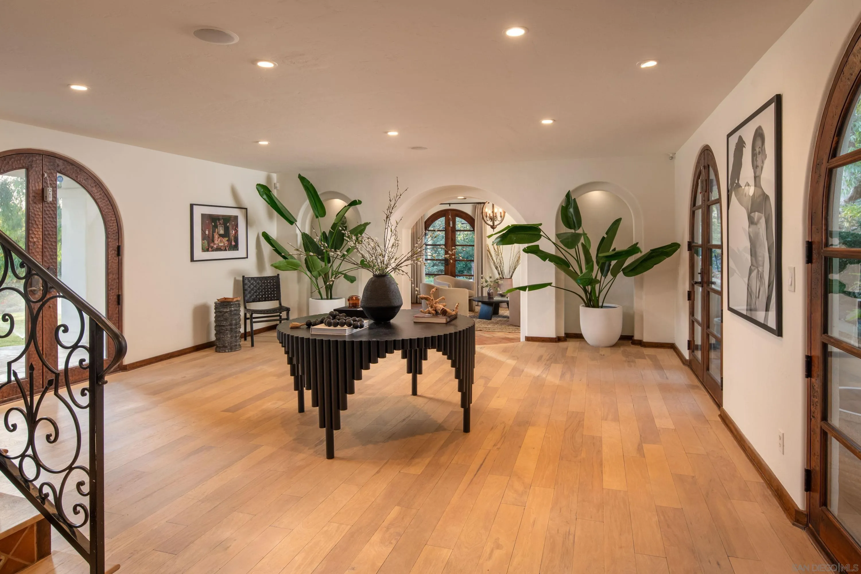 6511 Poco Lago Rancho Santa Fe, CA 92067 - Photo 10 of 24 a living room with furniture a potted plant and wooden floor