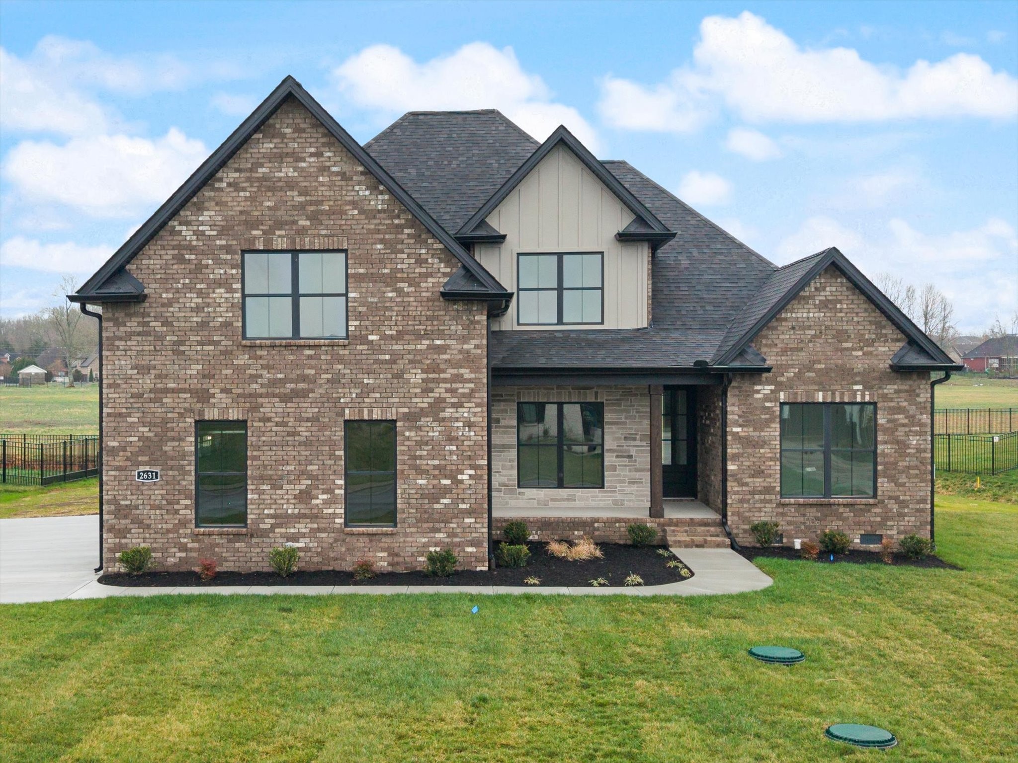 a front view of a house with a yard