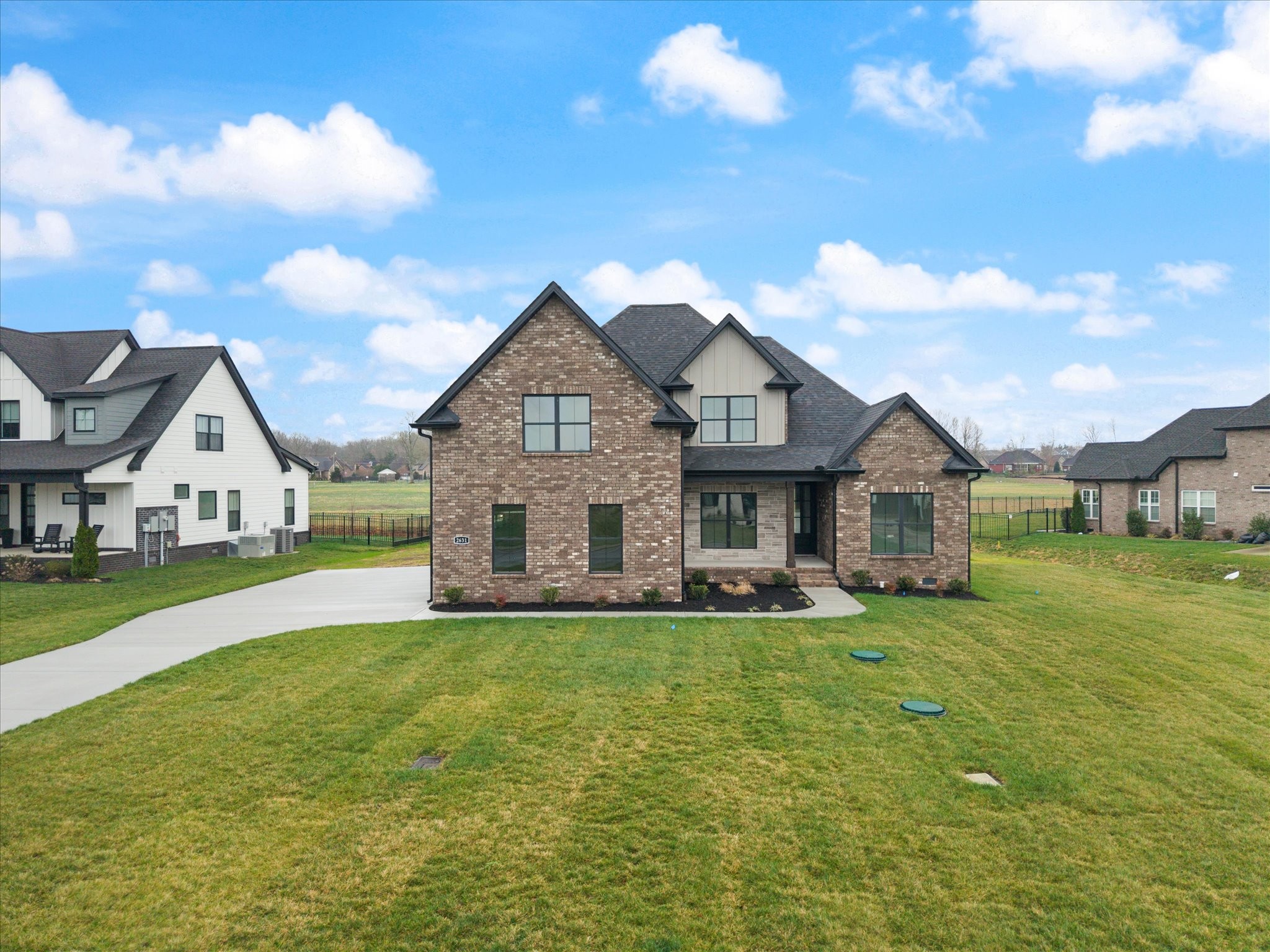 2631 Holly Spring Drive Murfreesboro, TN 37128 - Photo 2 of 33 a front view of a house with a garden and yard