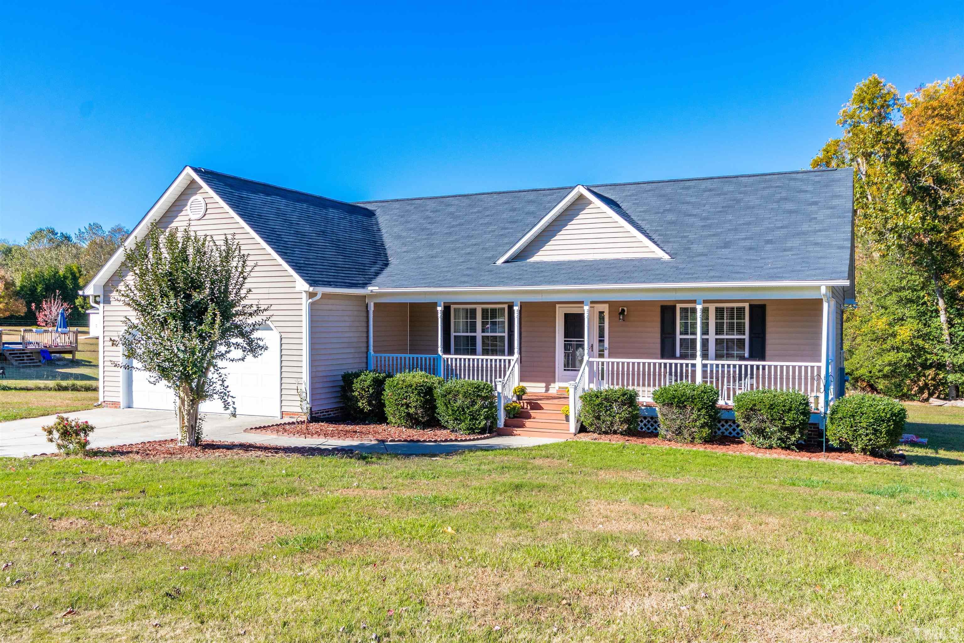 519 Axum Road Willow Spring, NC 27592 - Photo 1 of 30 a front view of a house with a yard