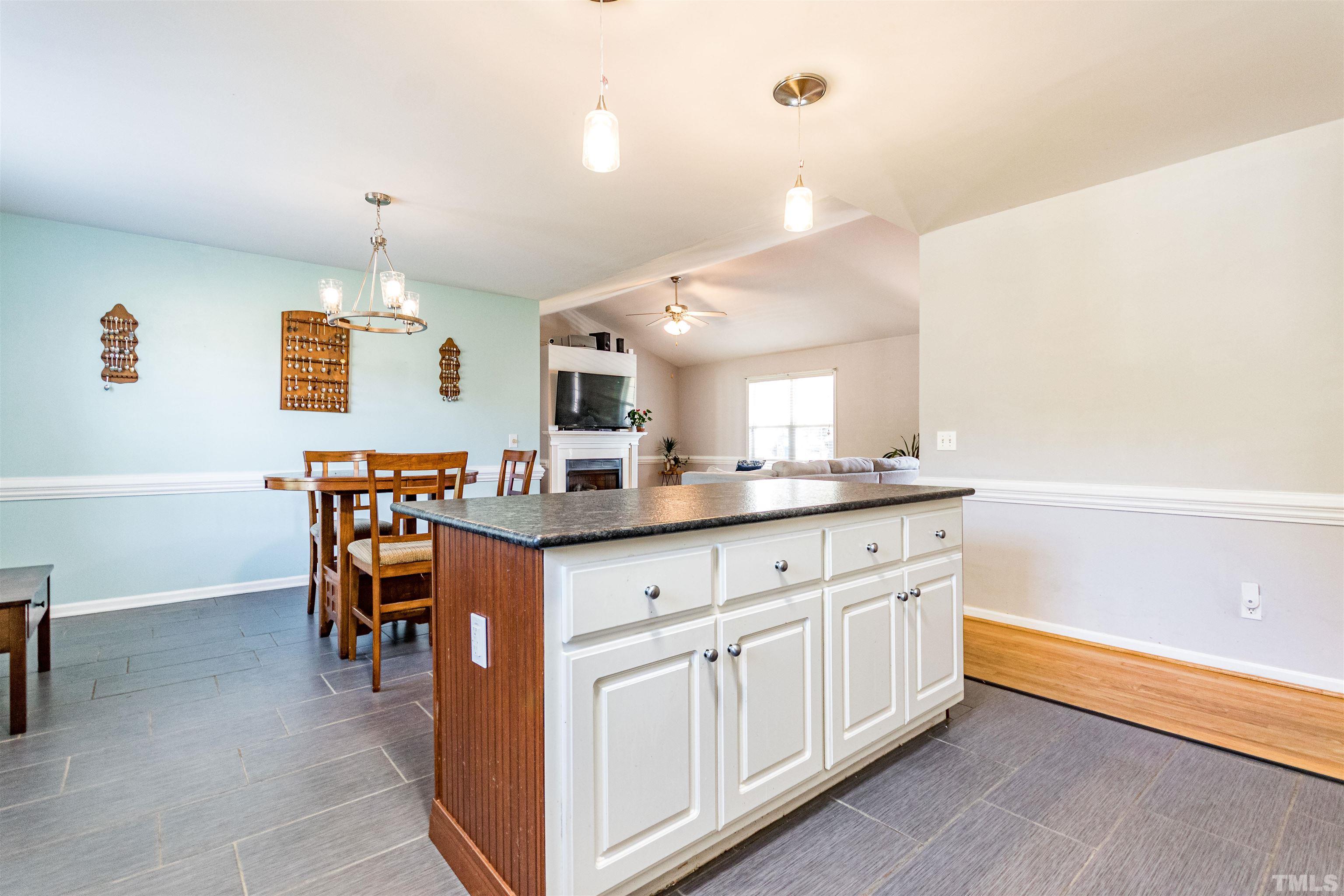519 Axum Road Willow Spring, NC 27592 - Photo 12 of 30 a kitchen with granite countertop breakfast area