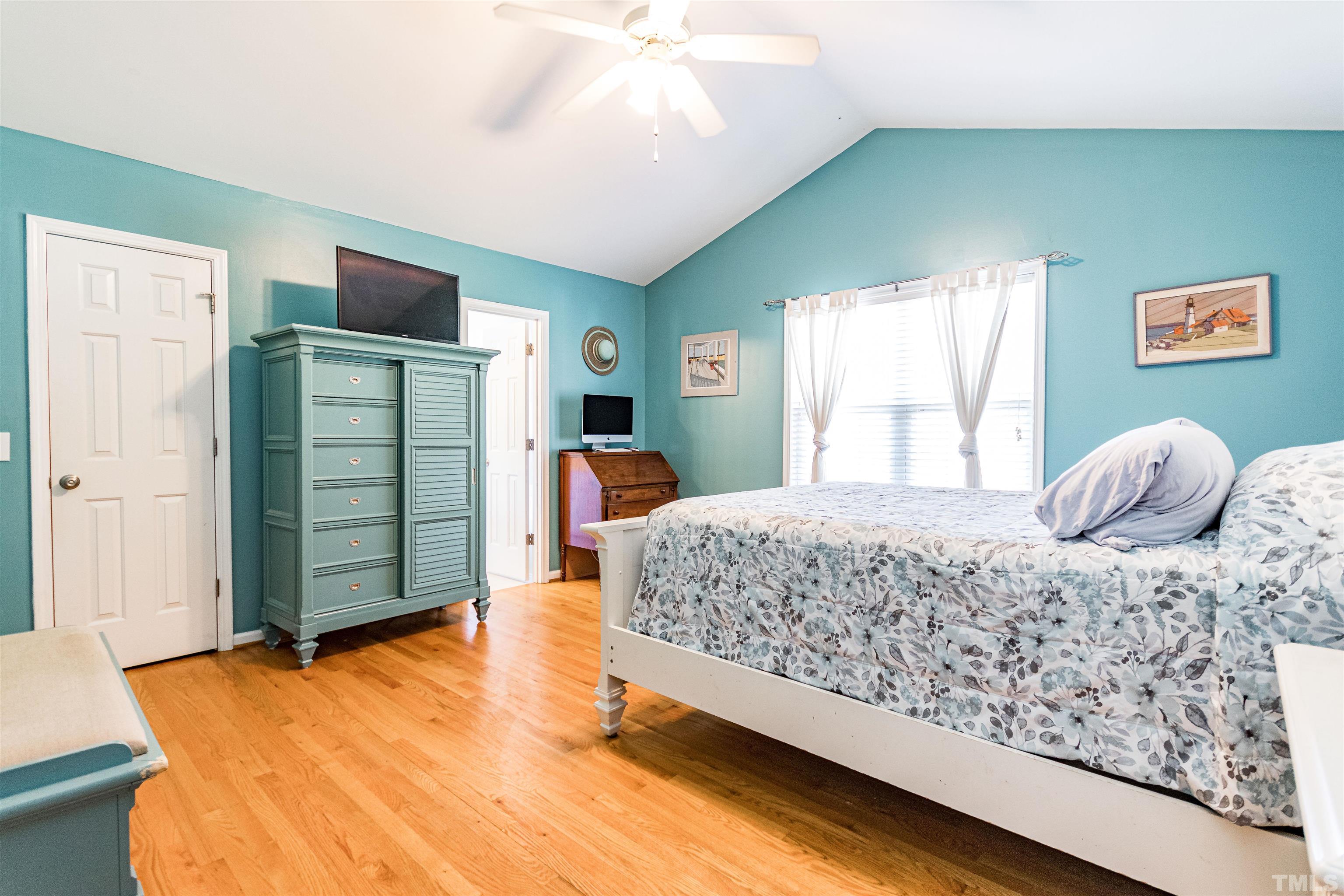 519 Axum Road Willow Spring, NC 27592 - Photo 17 of 30 a bedroom with a dresser and a window