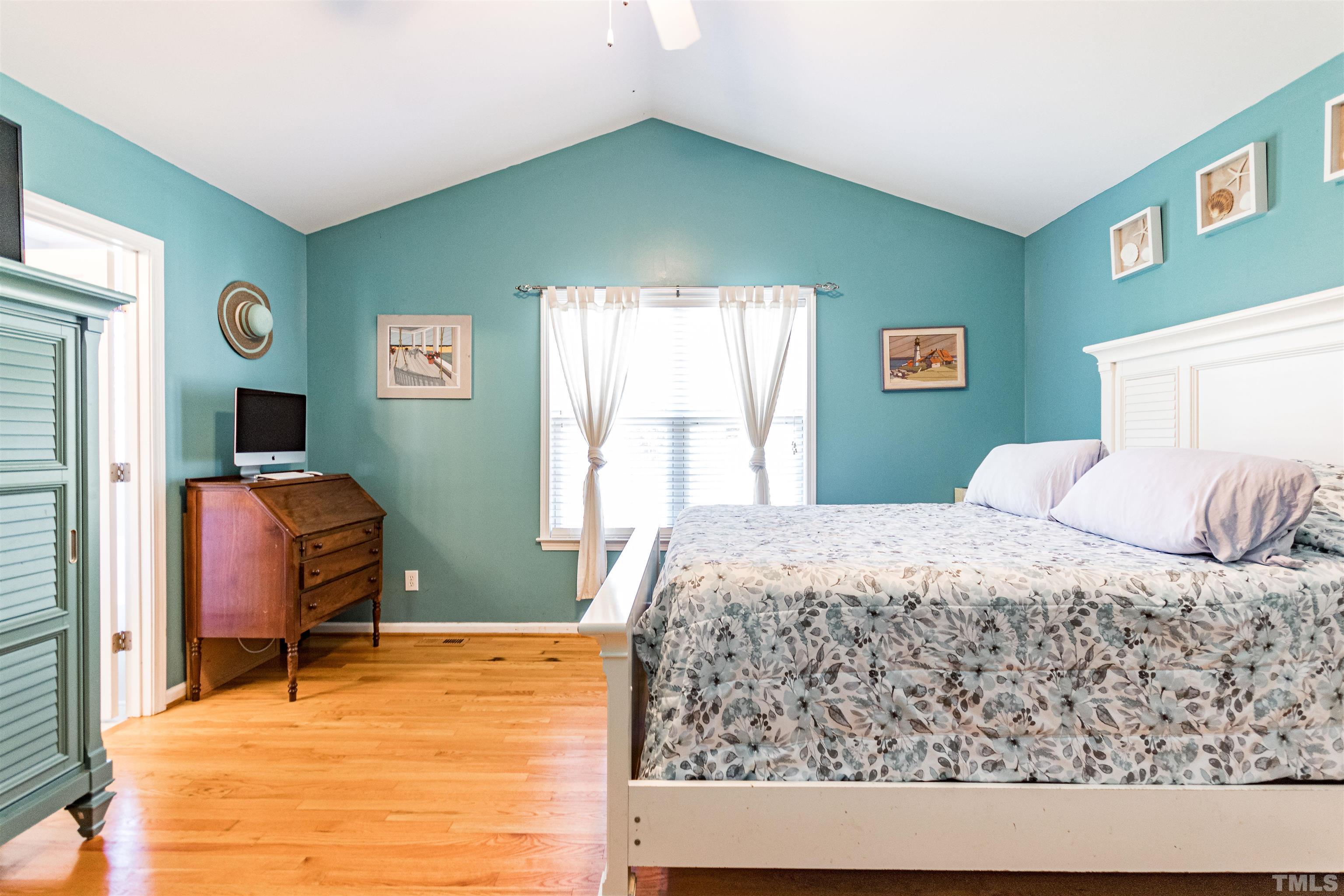 519 Axum Road Willow Spring, NC 27592 - Photo 18 of 30 a bedroom with a bed and windows