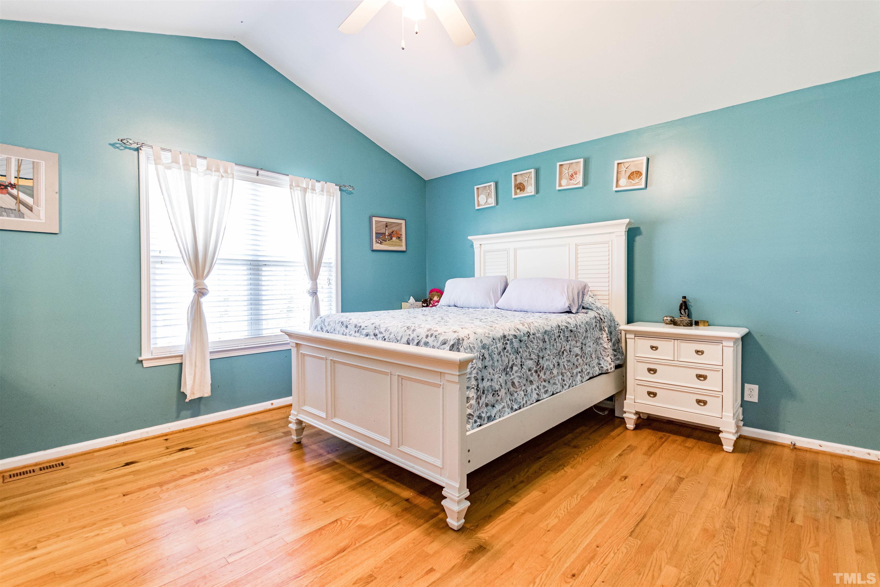 519 Axum Road Willow Spring, NC 27592 - Photo 19 of 30 a bedroom with a bed and a dresser