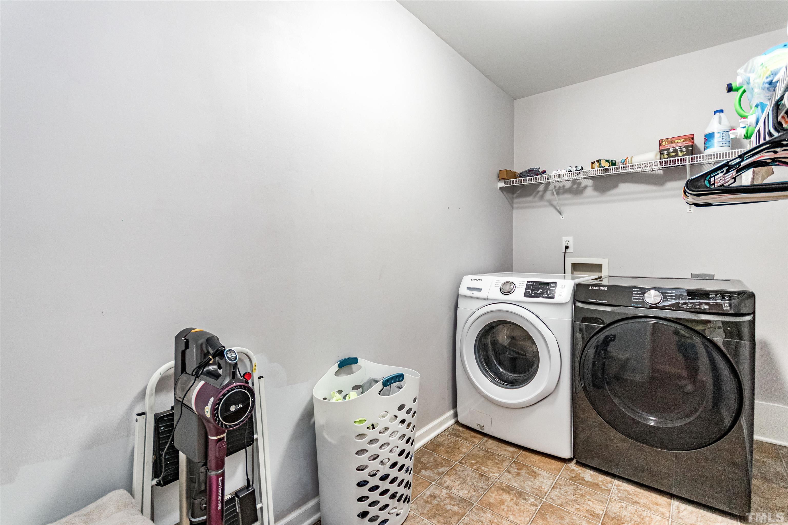519 Axum Road Willow Spring, NC 27592 - Photo 23 of 30 a utility room with dryer and washer