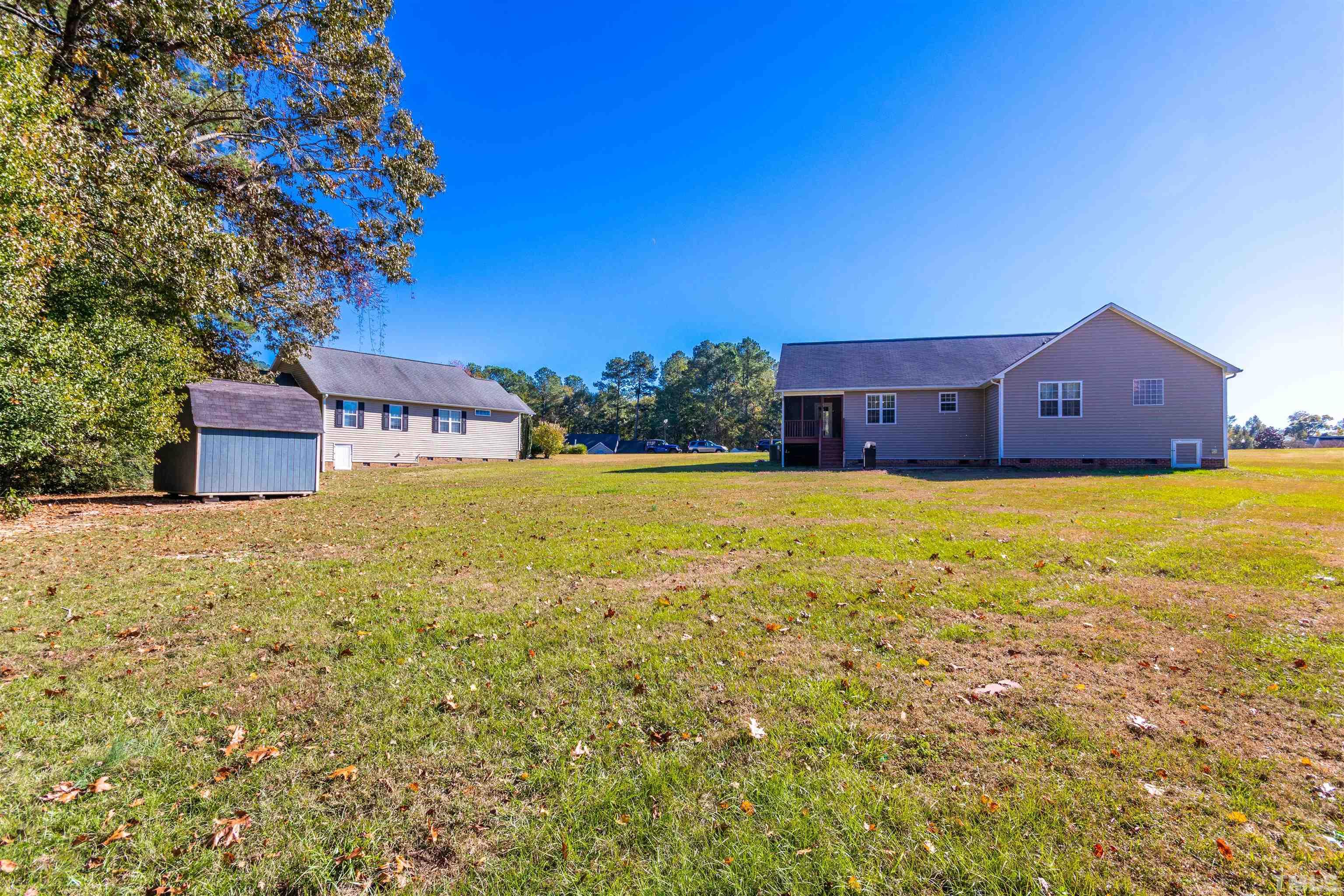 519 Axum Road Willow Spring, NC 27592 - Photo 29 of 30 a view of a house with a yard