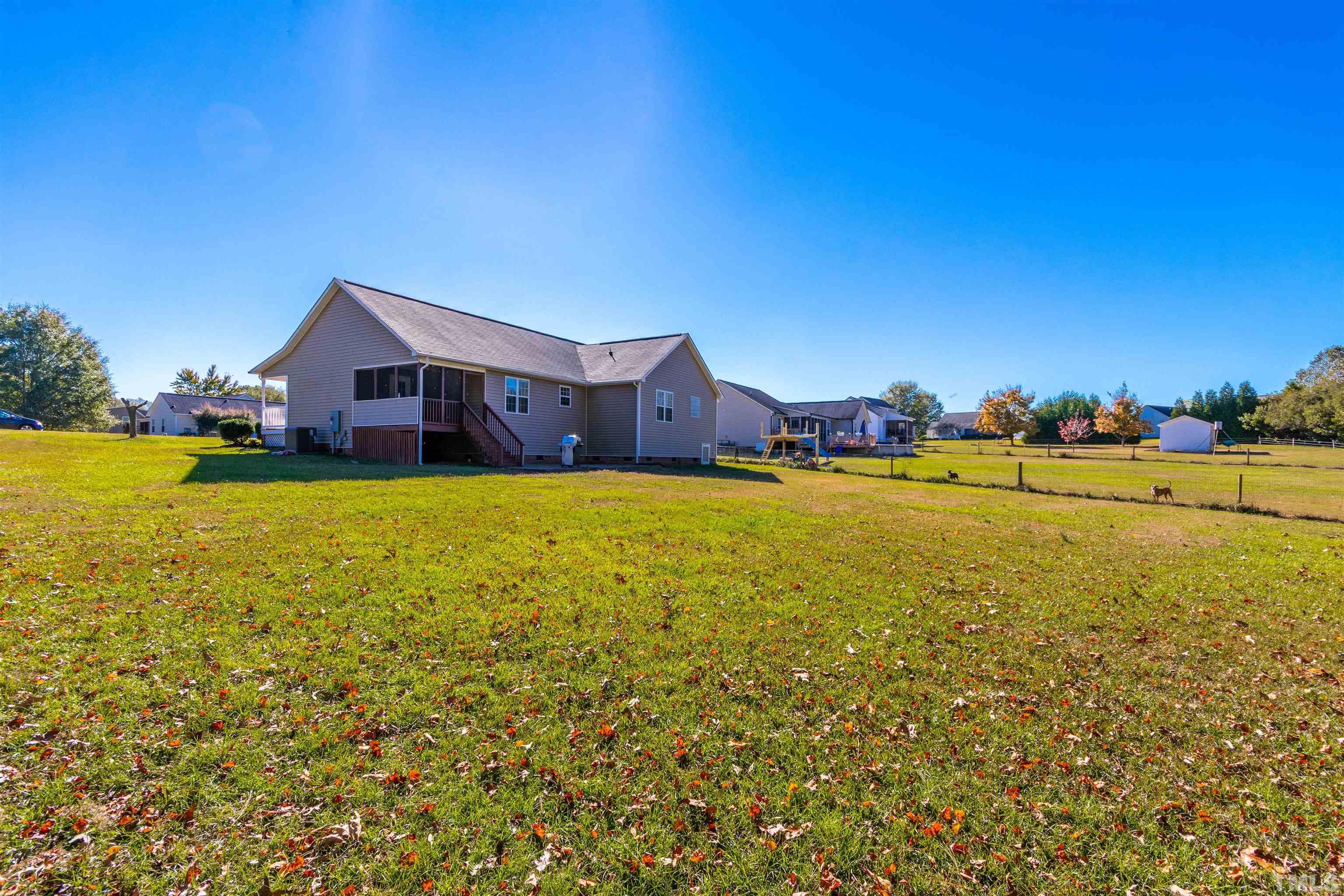 519 Axum Road Willow Spring, NC 27592 - Photo 30 of 30 a view of a house with yard and ocean view