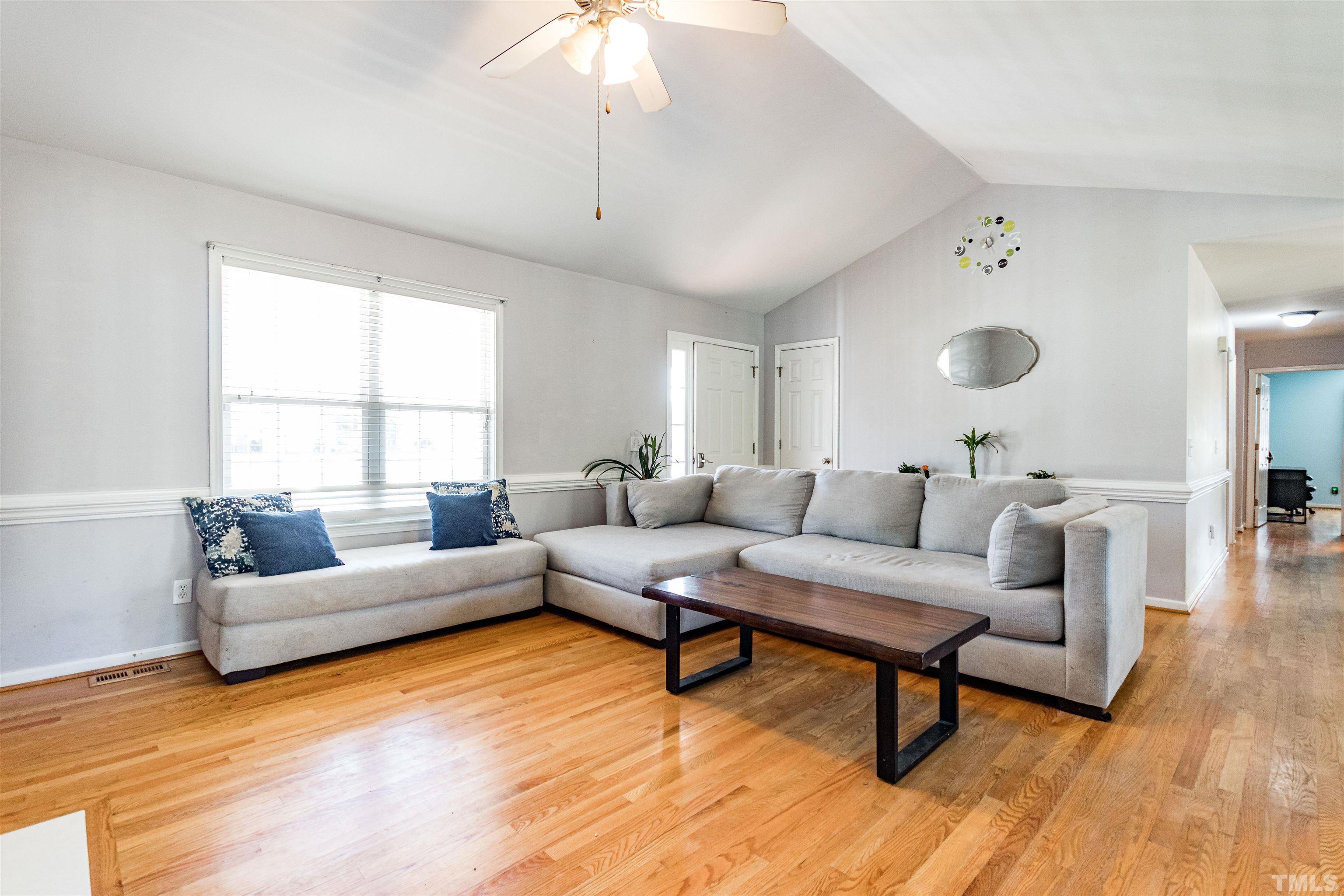 519 Axum Road Willow Spring, NC 27592 - Photo 4 of 30 a living room with furniture and a large window