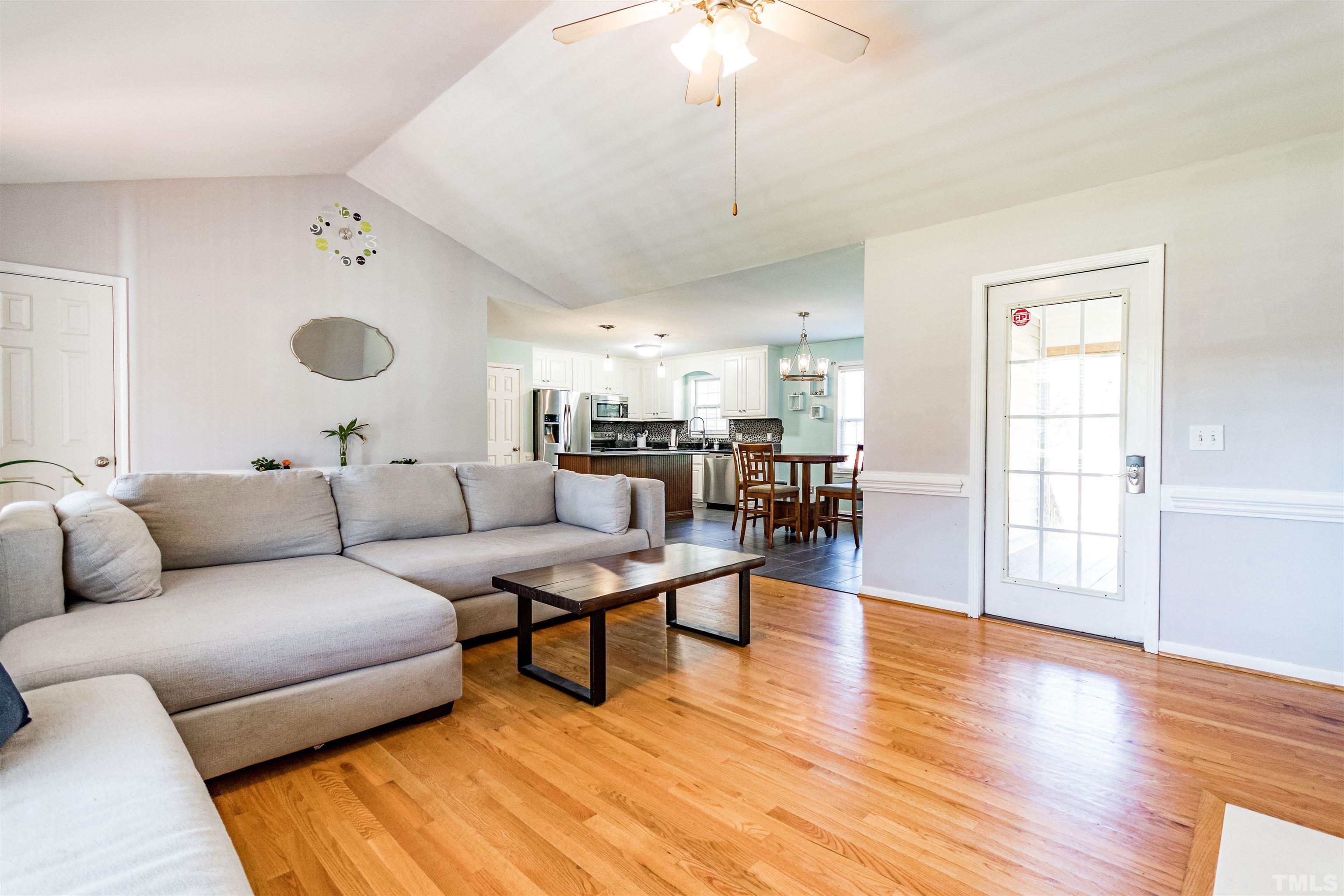 519 Axum Road Willow Spring, NC 27592 - Photo 6 of 30 a living room with furniture and a wooden floor