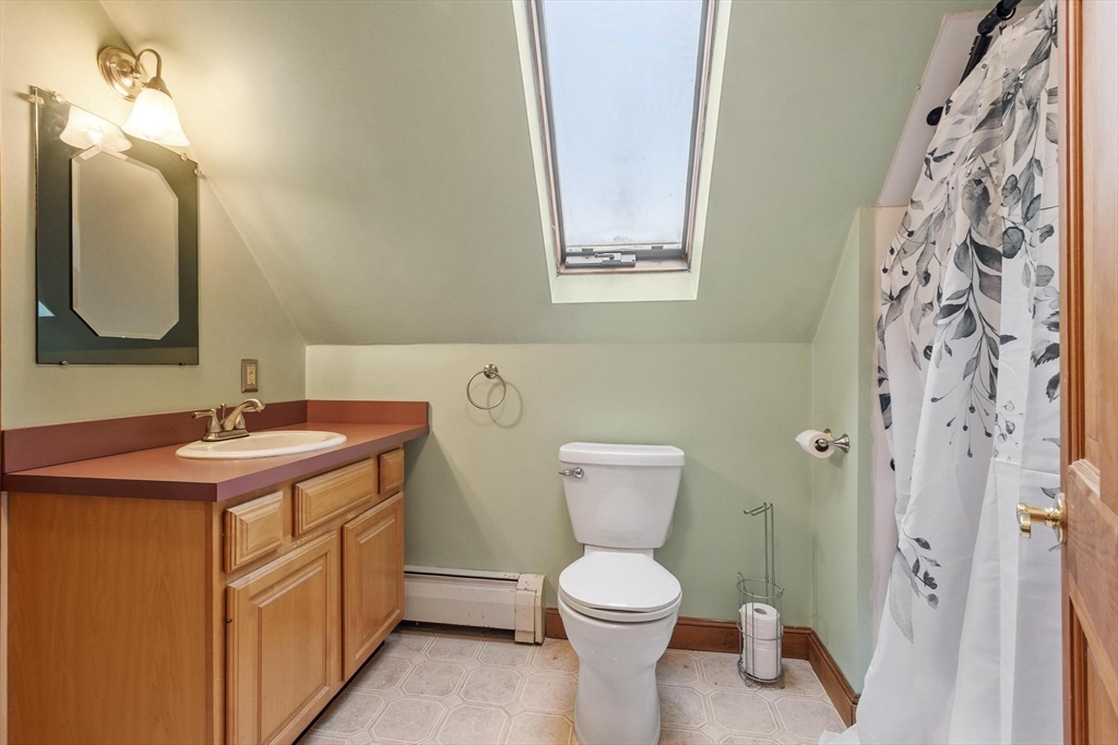 340 Ball Hill Road Princeton, MA 01541 - Photo 38 of 41 a bathroom with a toilet sink and mirror