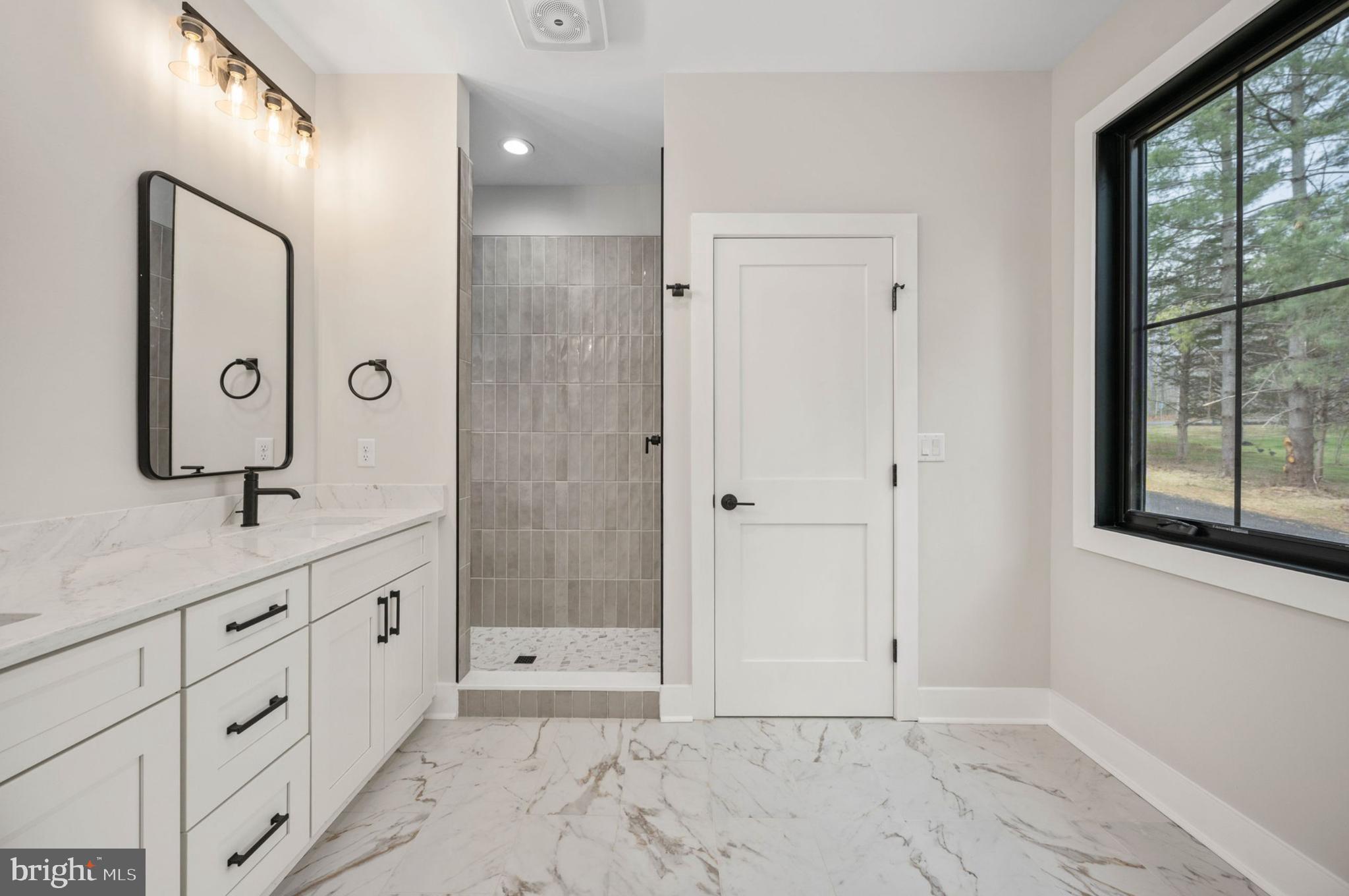 75 Sleepy Hollow Road Linden, VA 22642 - Photo 5 of 19 a bathroom with a granite countertop sink mirror and shower