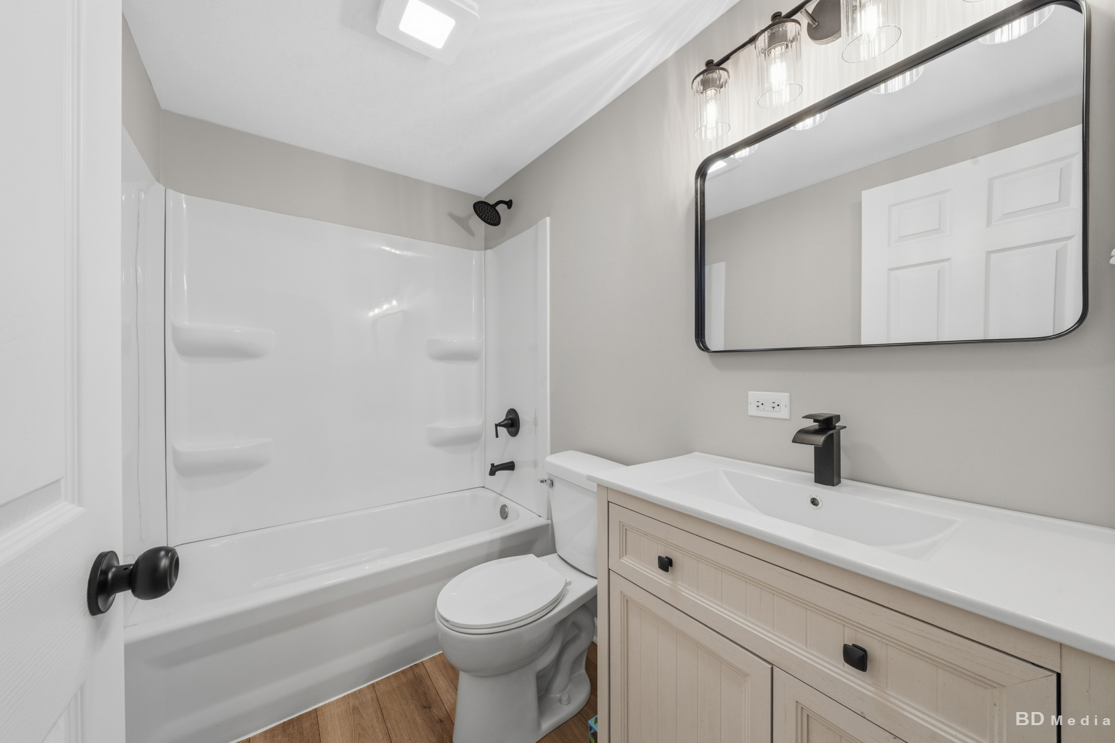3300 Butler Avenue Steger, IL 60475 - Photo 13 of 16 a bathroom with a sink a toilet and a mirror
