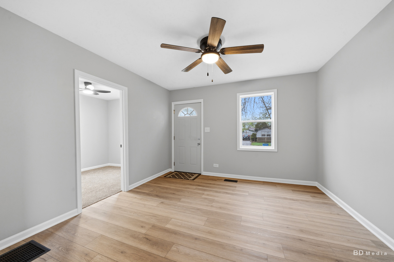 3300 Butler Avenue Steger, IL 60475 - Photo 6 of 16 a view of a big room with wooden floor and windows in a room
