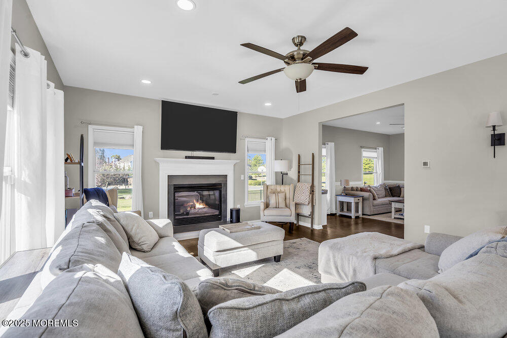 11 Cutter Court Cream Ridge, NJ 08514 - Photo 27 of 87 a living room with furniture a fireplace and a flat screen tv