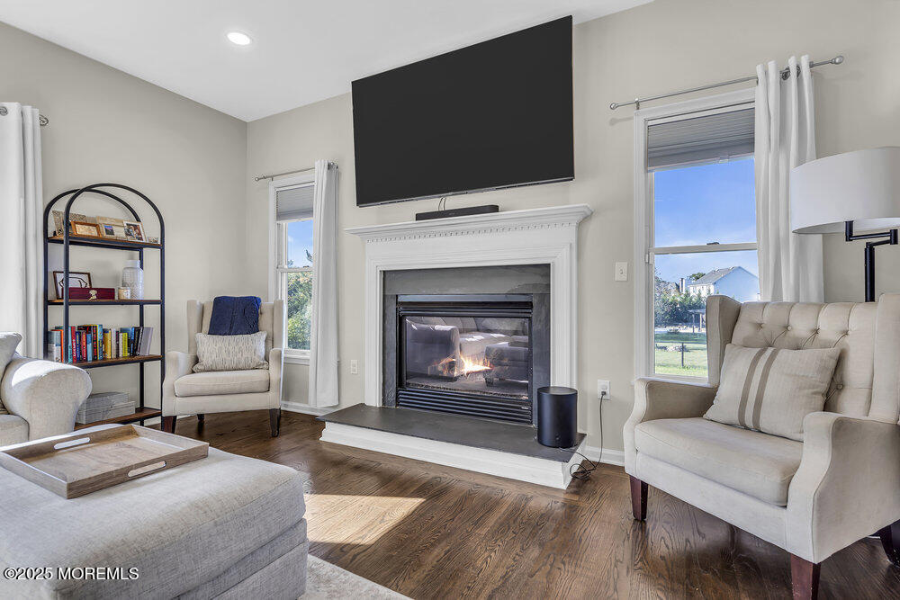 11 Cutter Court Cream Ridge, NJ 08514 - Photo 28 of 87 a living room with furniture a fireplace and a flat screen tv