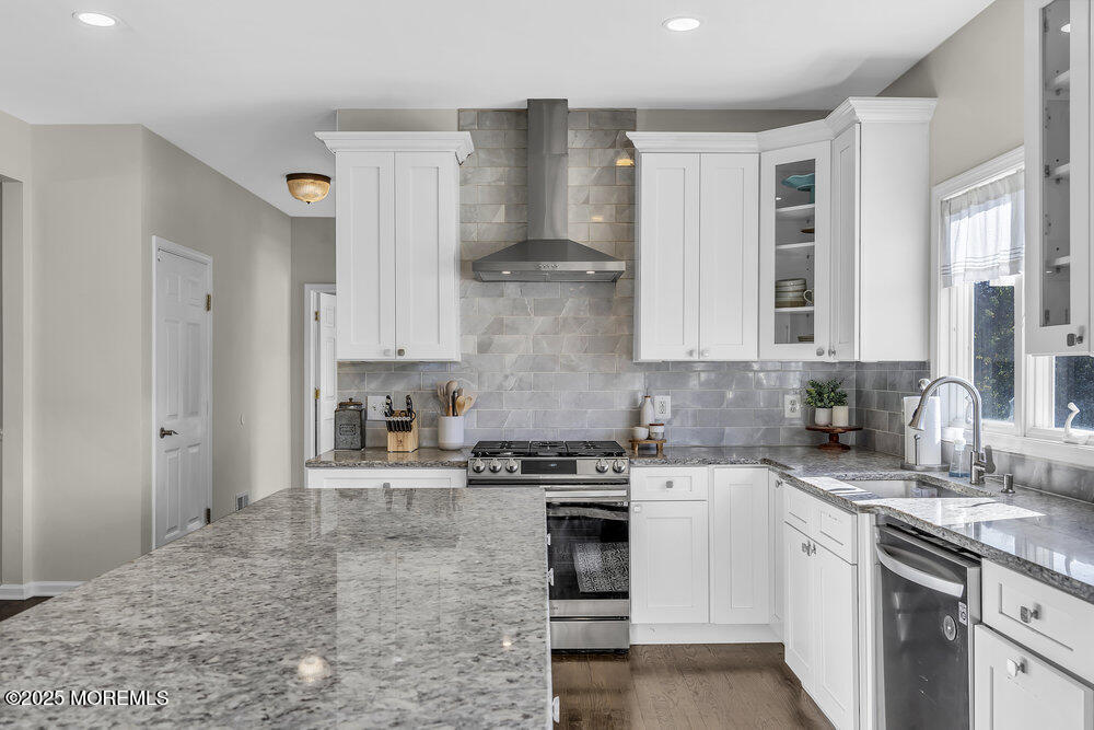 11 Cutter Court Cream Ridge, NJ 08514 - Photo 38 of 87 a kitchen with stainless steel appliances granite countertop a stove and a sink