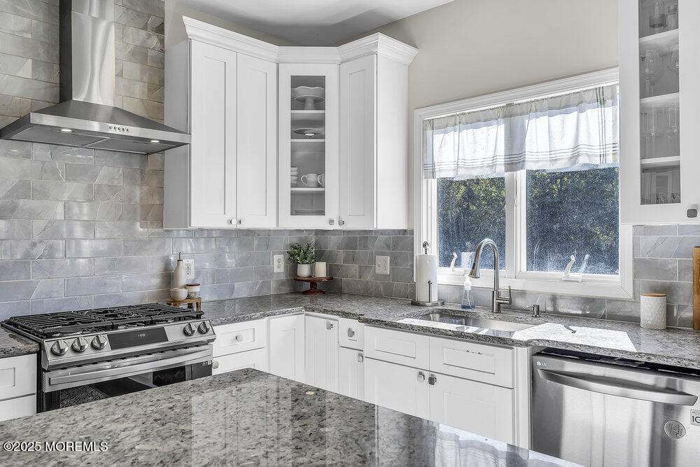 11 Cutter Court Cream Ridge, NJ 08514 - Photo 40 of 87 a kitchen with stainless steel appliances granite countertop a sink stove and cabinets