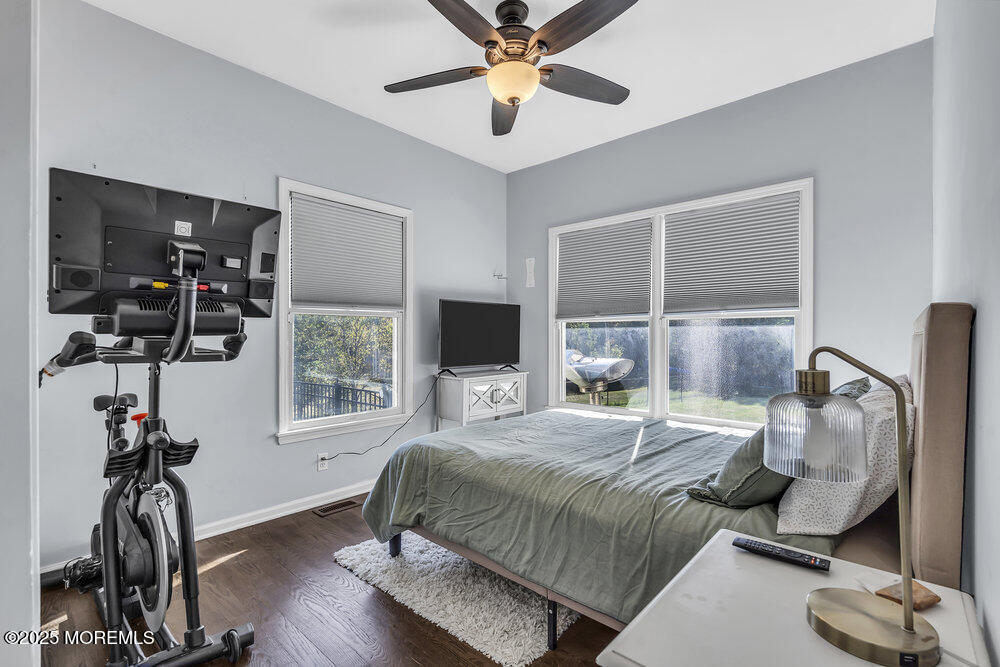 11 Cutter Court Cream Ridge, NJ 08514 - Photo 46 of 87 a bedroom with a bed and wooden floor