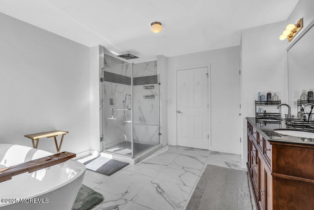 11 Cutter Court Cream Ridge, NJ 08514 - Photo 59 of 87 a spacious bathroom with a granite countertop sink and a mirror