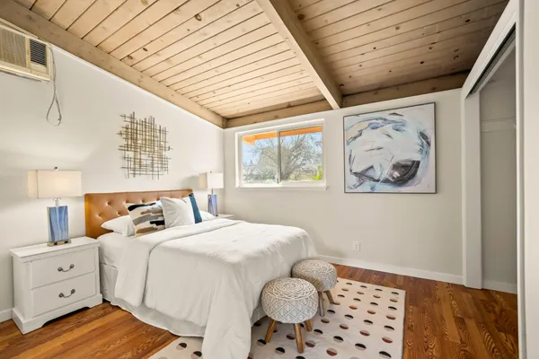 a bedroom with a bed and a lamp