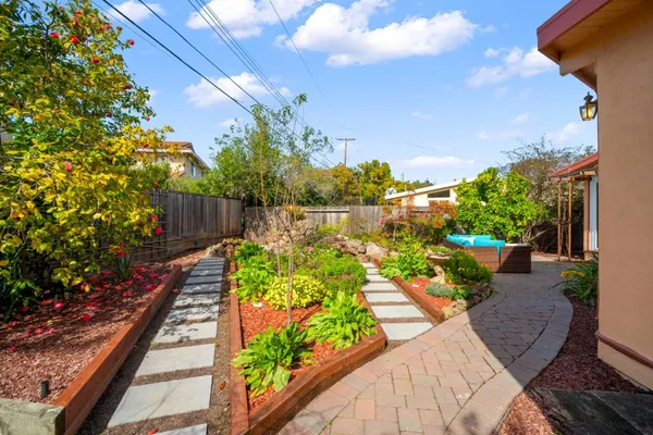 a view of a backyard with sitting area