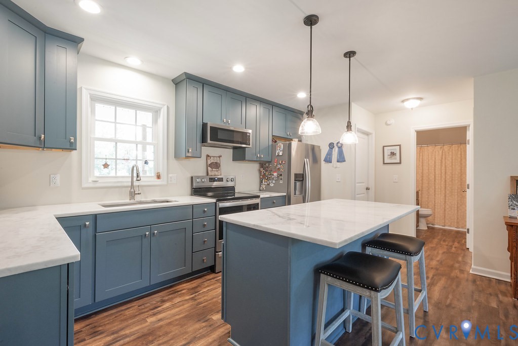 4336 Hells Bend Road Palmyra, VA 22963 - Photo 11 of 35 Kitchen featuring blue shaker-style cabinetry with