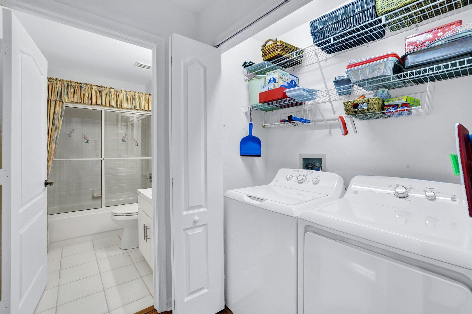 1006 Mainsail Drive, Unit 224 Naples, FL 34114 - Photo 19 of 30 a storage room with washer and dryer