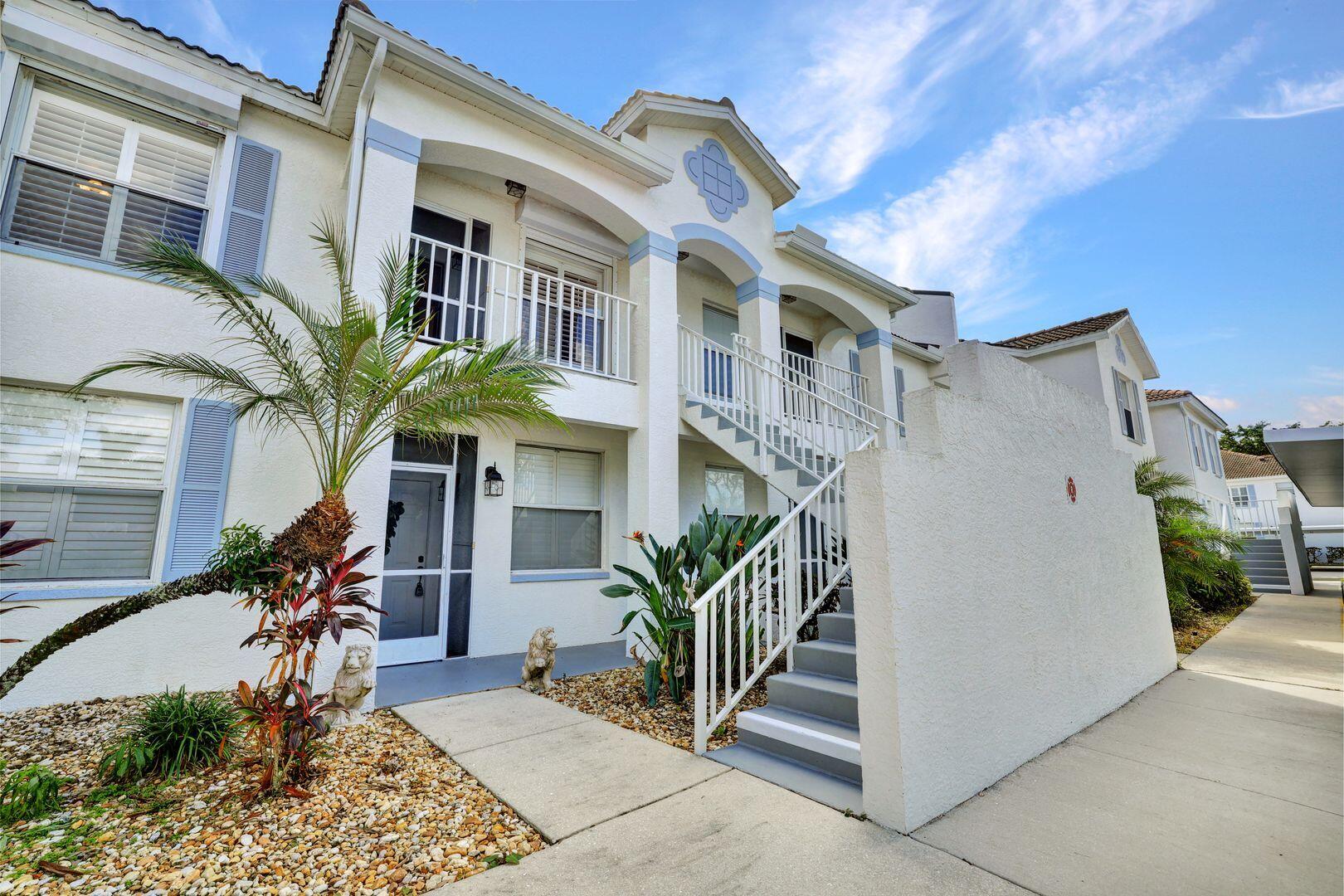 1006 Mainsail Drive, Unit 224 Naples, FL 34114 - Photo 2 of 30 a front view of a house with balcony