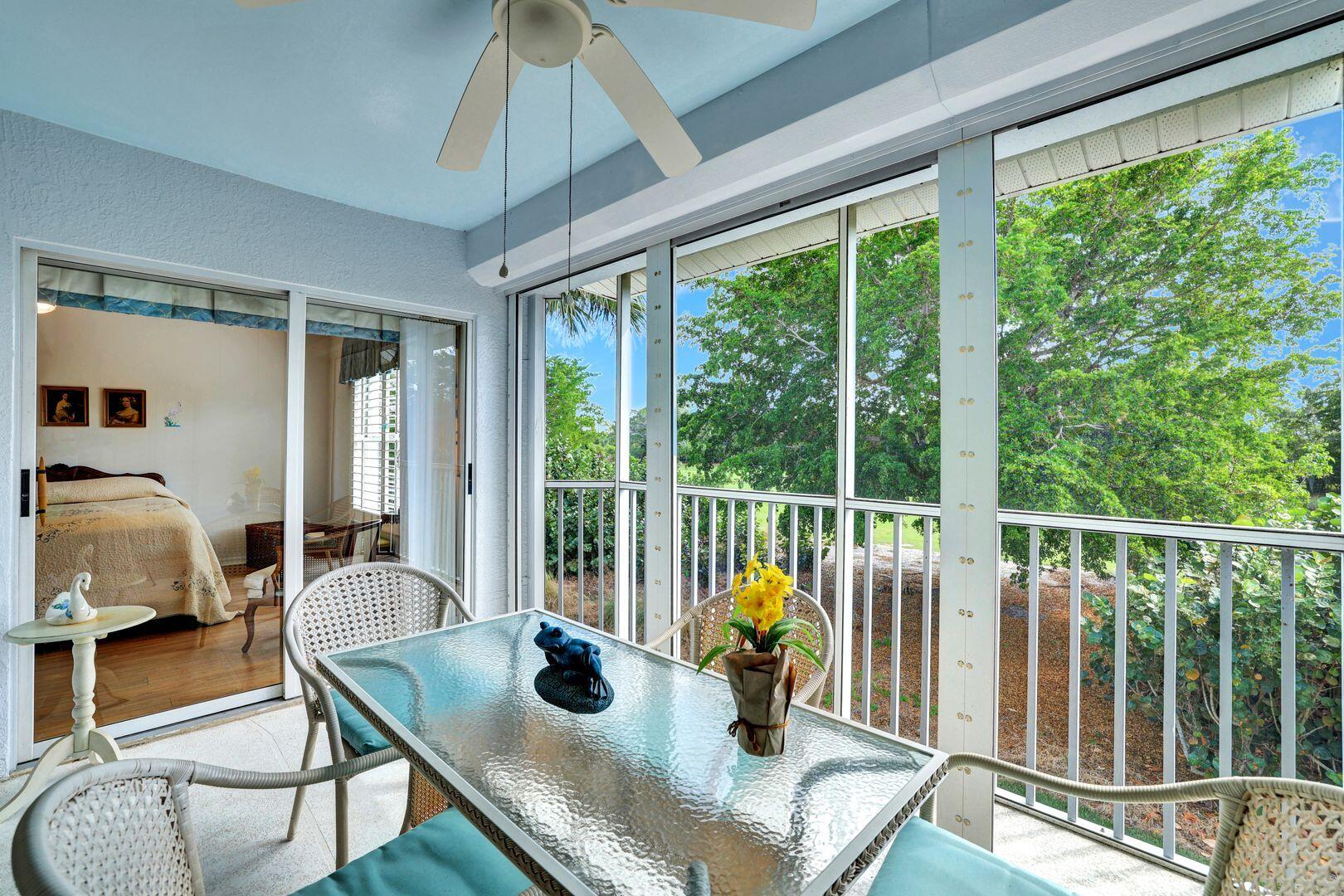 1006 Mainsail Drive, Unit 224 Naples, FL 34114 - Photo 23 of 30 a living room with furniture and a large window