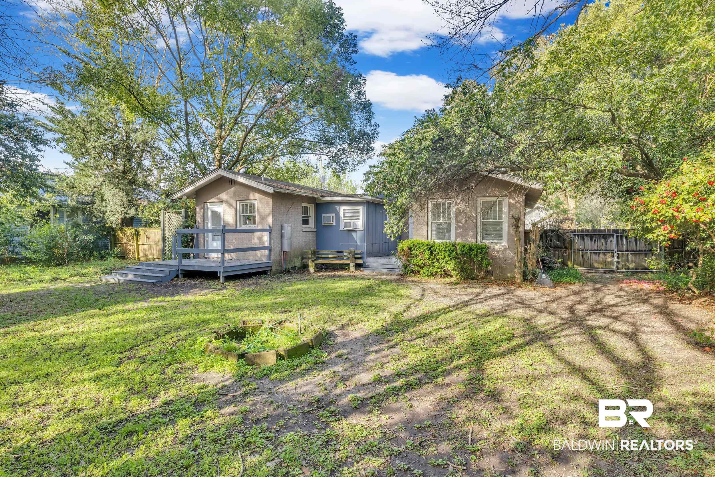 55 Mohawk Street Mobile, AL 36606 - Photo 13 of 28 Exterior space featuring a yard, fence, and a wooden deck