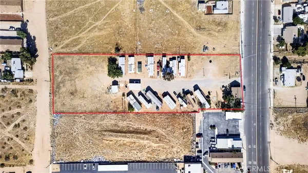 an aerial view of residential building and parking space