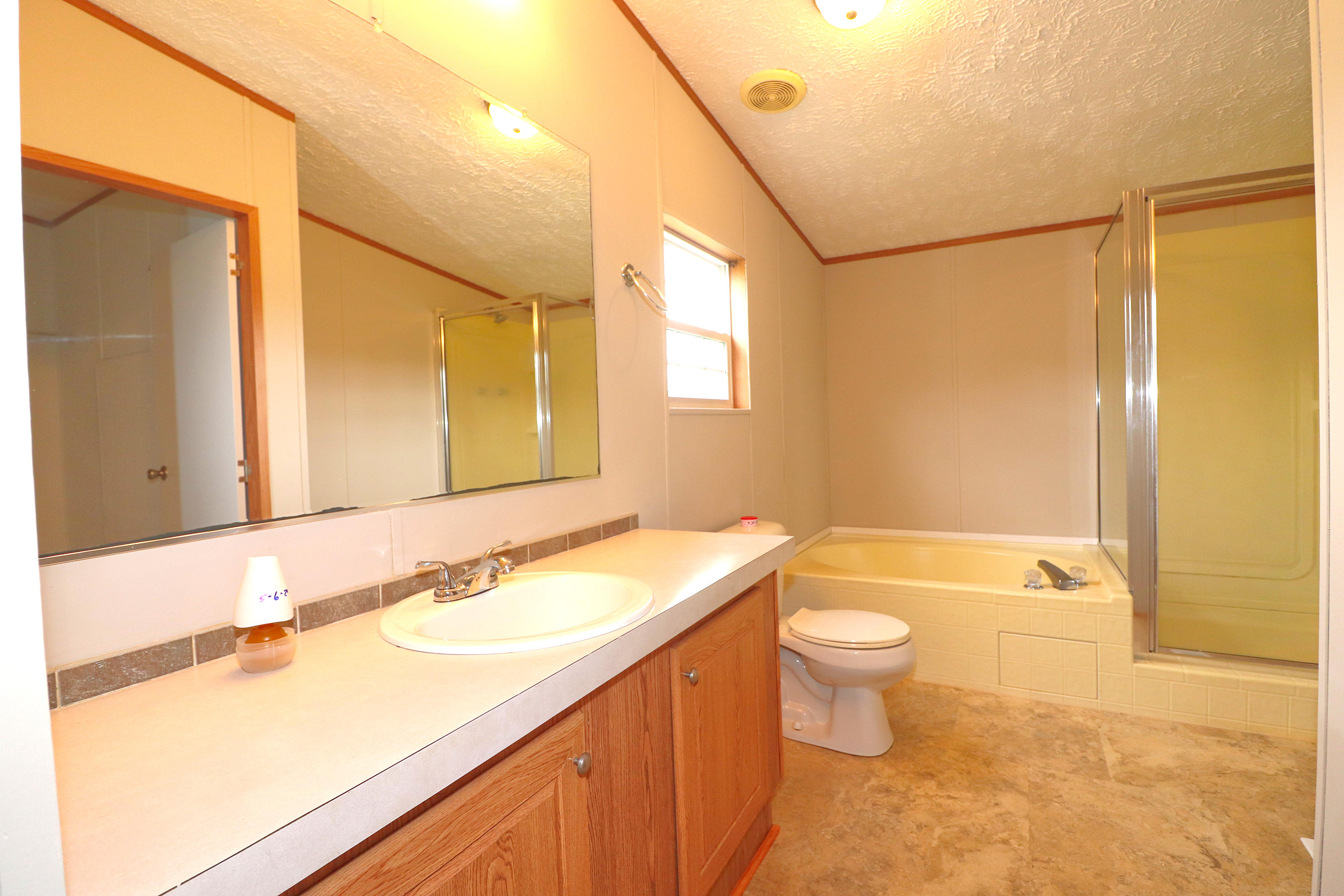 615 Edwards Road Penhook, VA 24137 - Photo 14 of 16 a bathroom with a sink a toilet and shower
