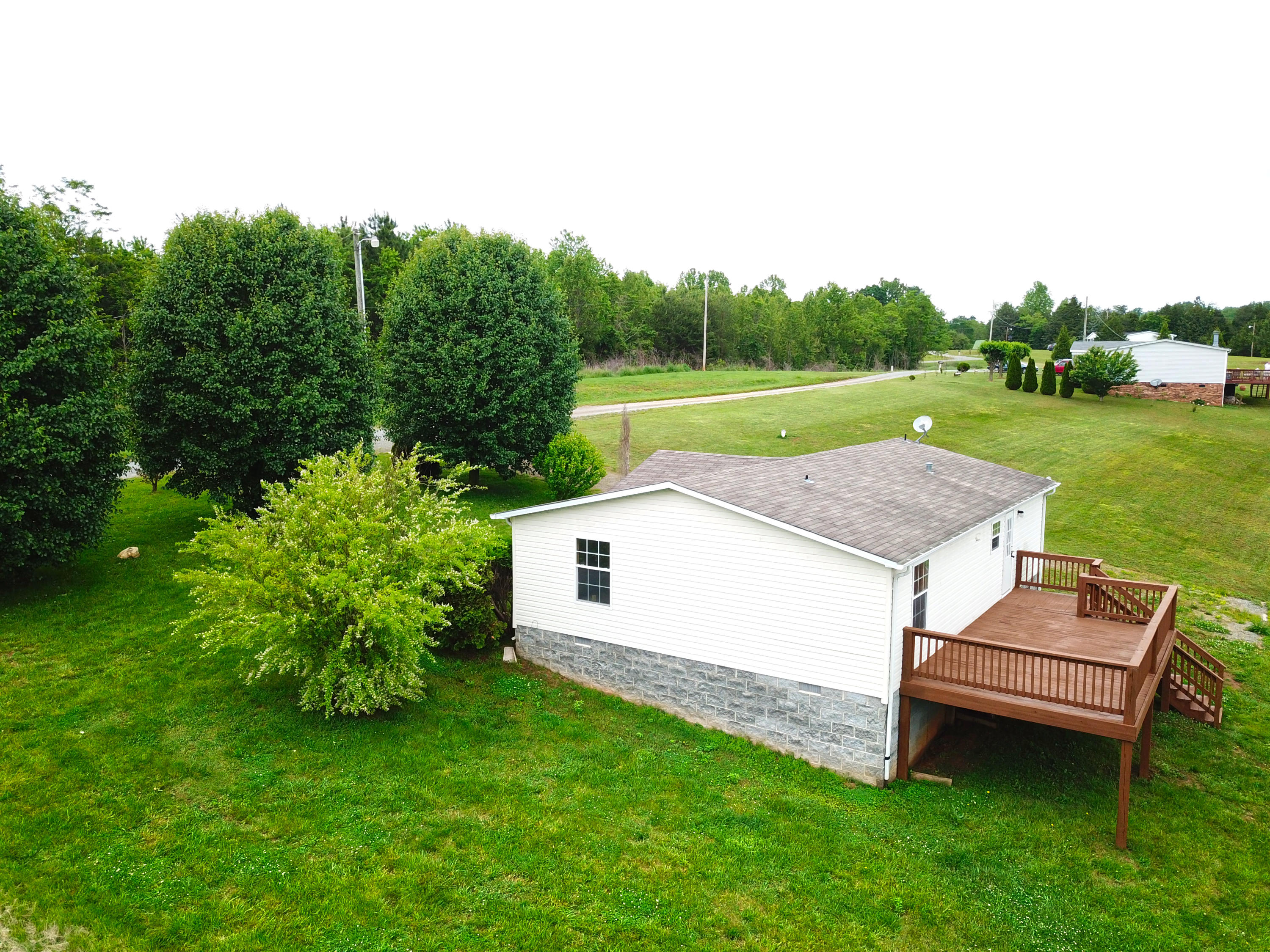 615 Edwards Road Penhook, VA 24137 - Photo 3 of 16 a aerial view of a house with backyard and a garden