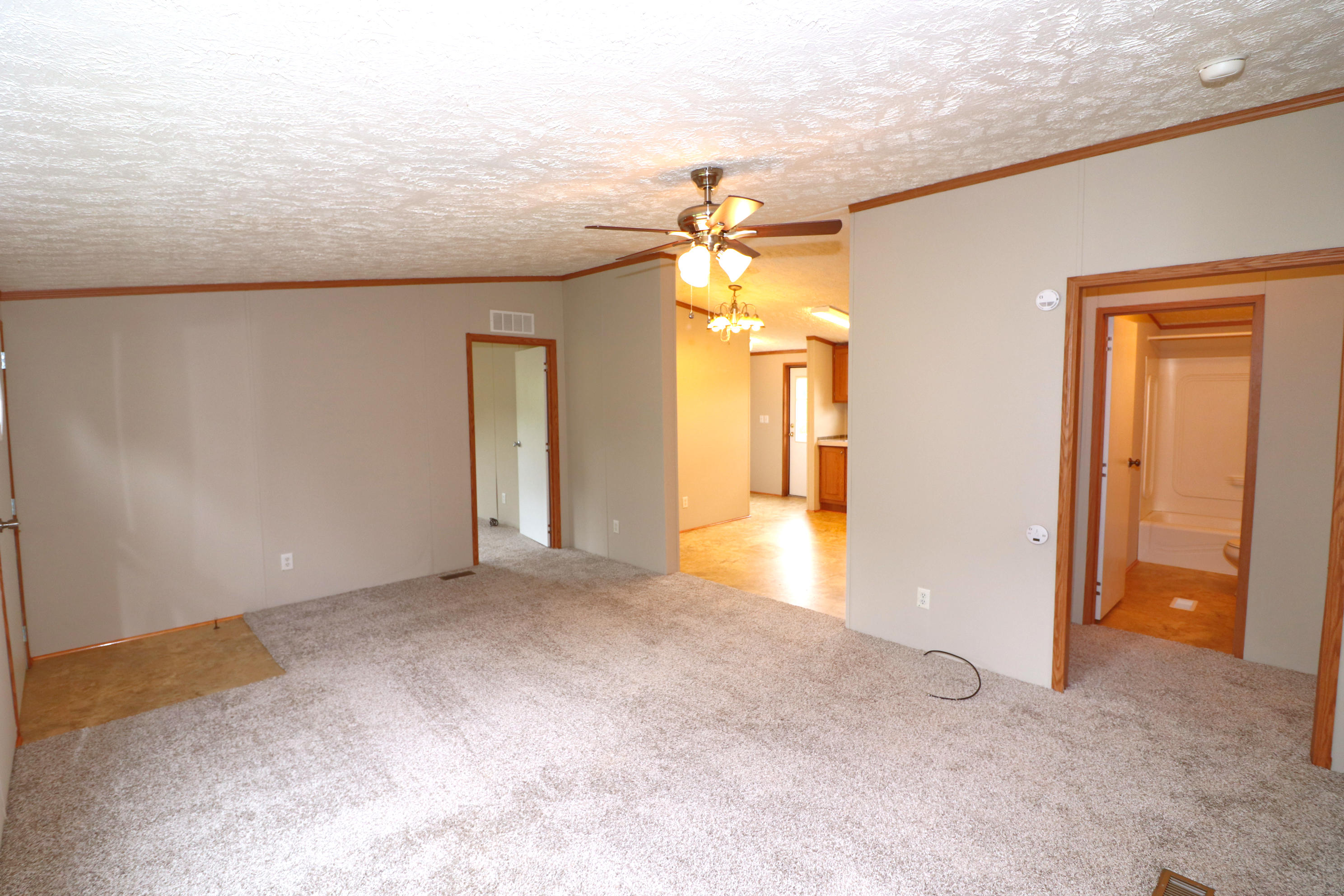 615 Edwards Road Penhook, VA 24137 - Photo 6 of 16 a view of a hallway with a chandelier