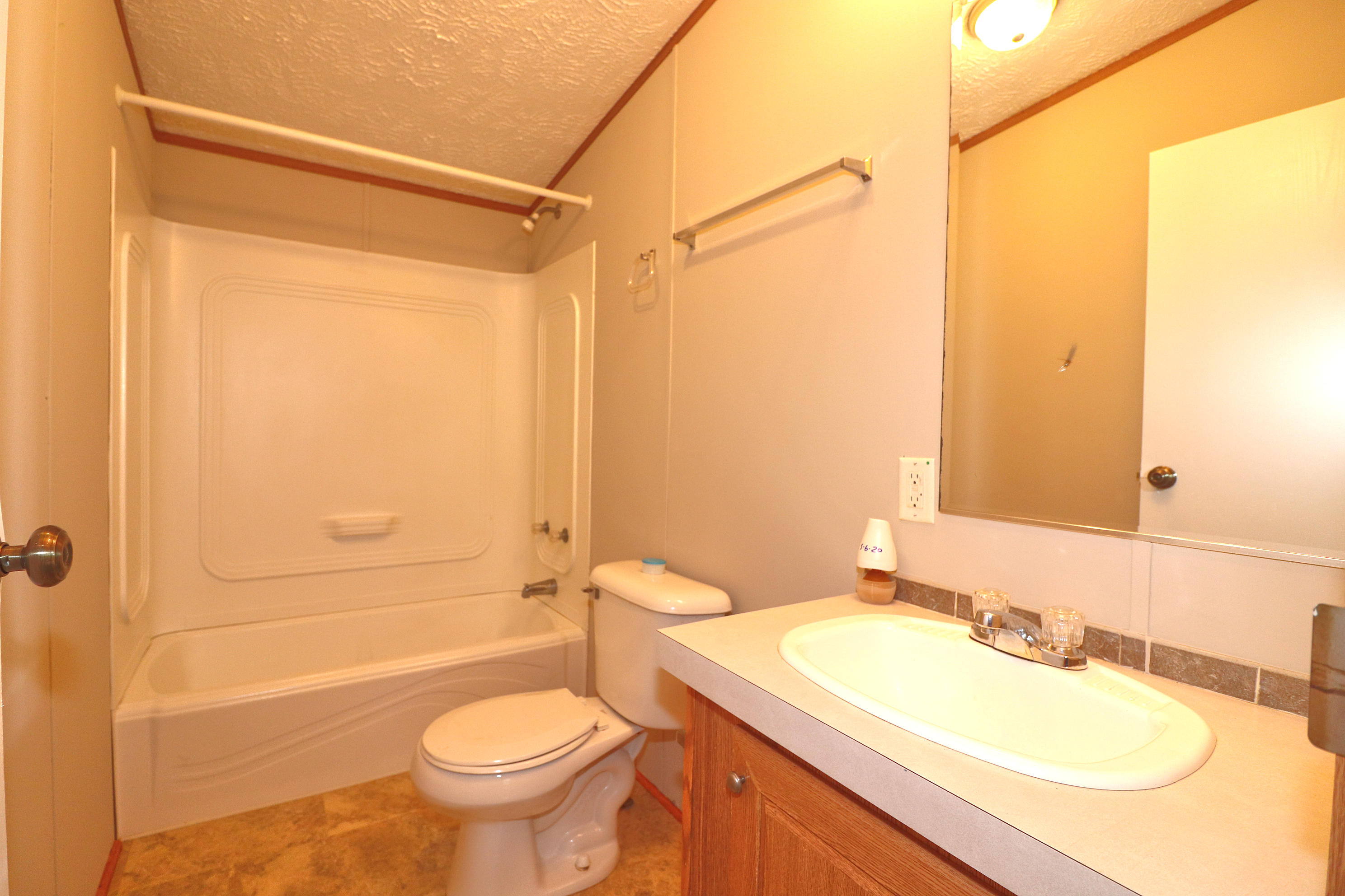 615 Edwards Road Penhook, VA 24137 - Photo 10 of 16 a bathroom with a sink a toilet and shower