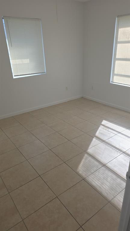 5241 Mayo Street Hollywood, FL 33021 - Photo 4 of 15 an empty room with a white walls and a window