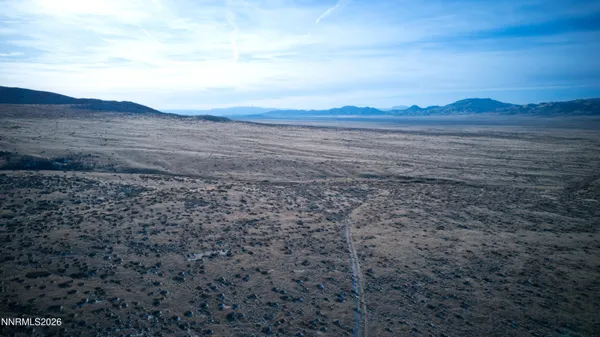 a view of an ocean beach and mountain