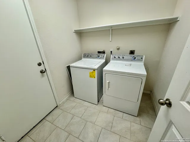 a utility room with dryer and washer