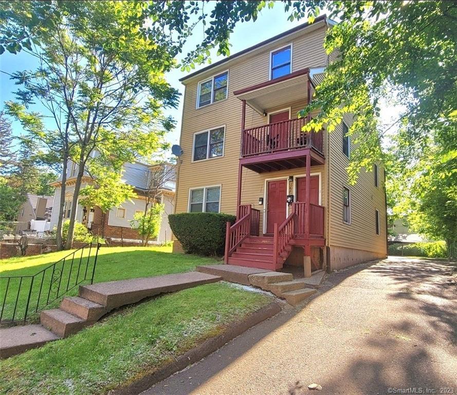 166 Clark Street, Unit B Hartford, CT 06120 - Photo 1 of 1 a front view of a house with a yard