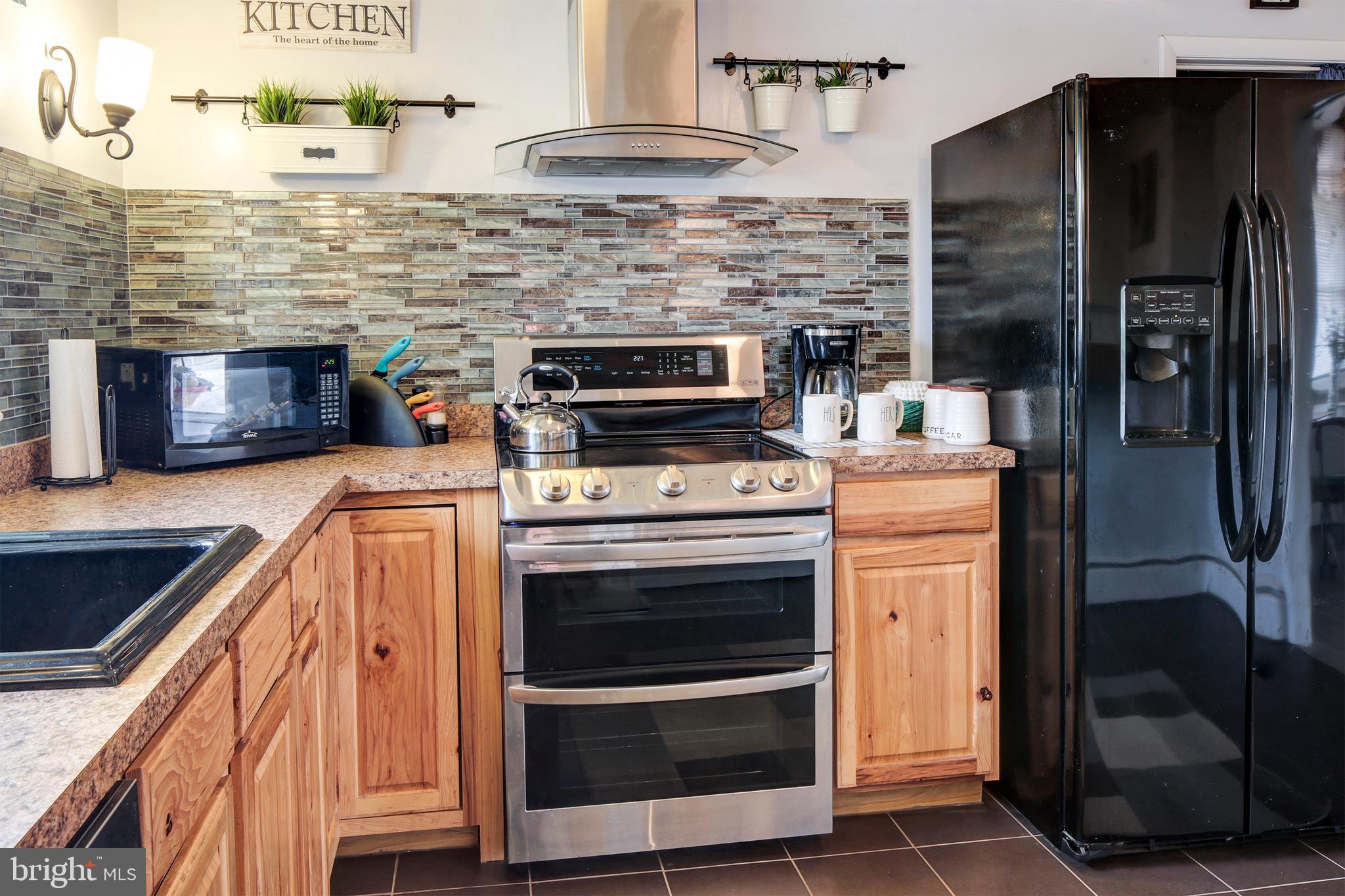 6107 Medora Road Linthicum, MD 21090 - Photo 10 of 31 Beautifully appointed with tile backsplash