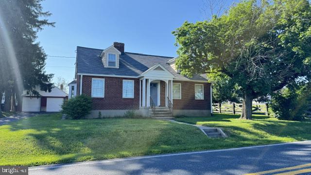 816 North Houcksville Road Hampstead, MD 21074 - Photo 23 of 23 Charming brick home with lush greenery.