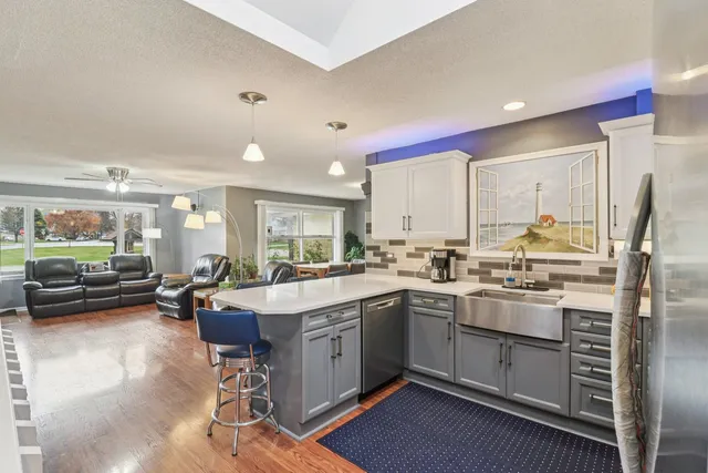a kitchen with lots of counter top space and dining table