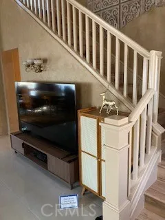 a view of staircase with rug