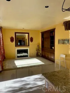 a living room with fireplace furniture and a flat screen tv