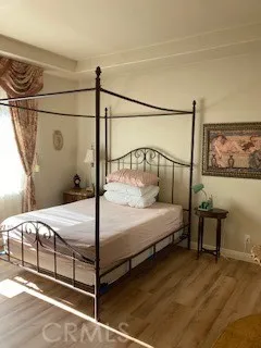 a bedroom with a bed and a table